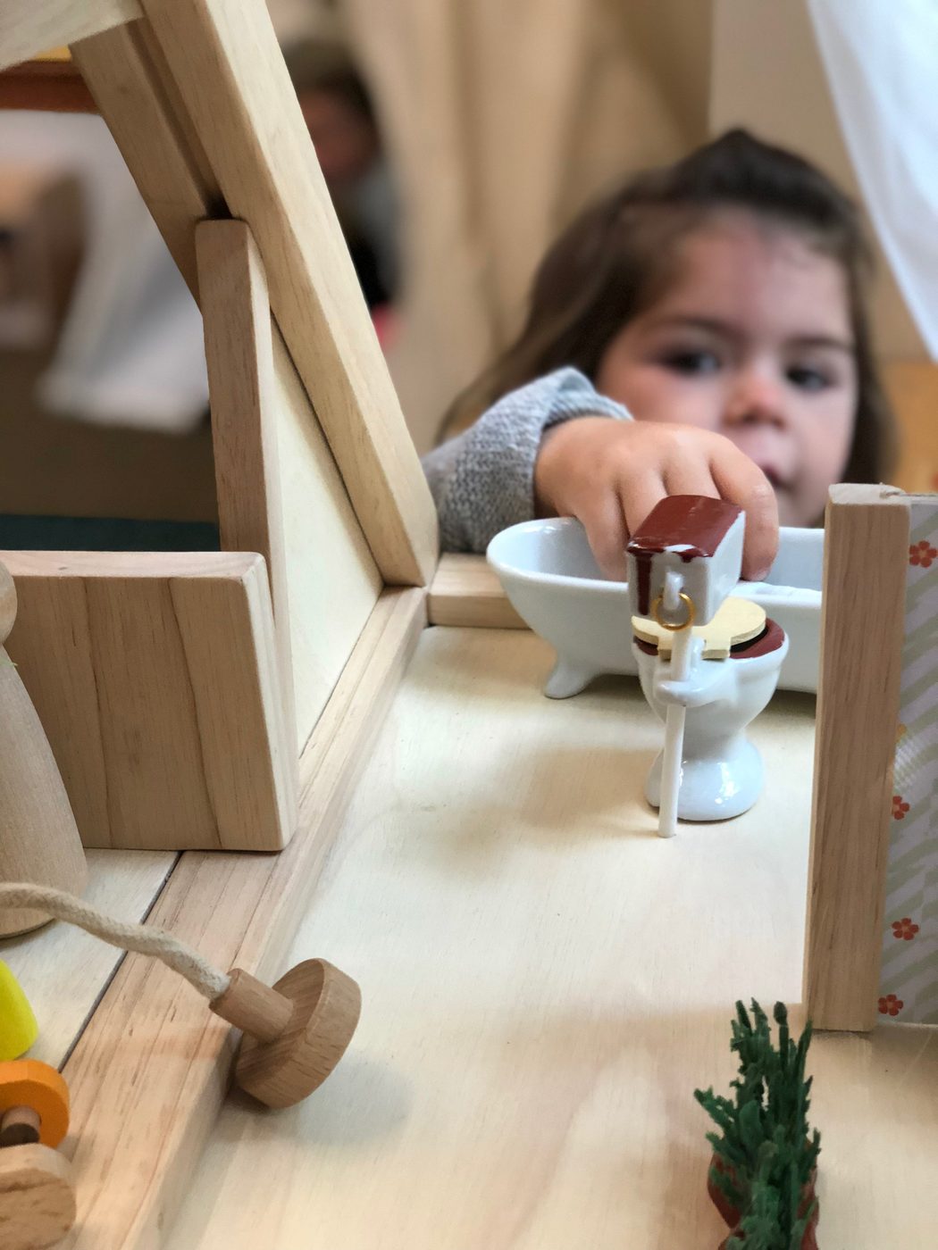 Child in dramatic play at The Ross Preschool